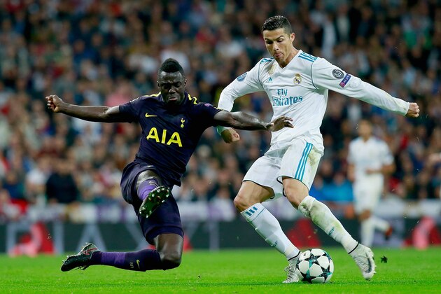 MADRID, SPAIN - OCTOBER 17: Davinson Sanchez of Tottenham Hotspur attempts to tackle Cristiano Ronaldo of Real Madrid during the UEFA Champions League group H match between Real Madrid and Tottenham Hotspur at Estadio Santiago Bernabeu on October 17, 2017 in Madrid, Spain.  (Photo by Gonzalo Arroyo Moreno/Getty Images)