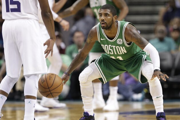 Boston Celtics' Kyrie Irving, guards Charlotte Hornets' Kemba Walker in the first half of a preseason NBA basketball game in Charlotte, N.C., Wednesday, Oct. 11, 2017. (AP Photo/Chuck Burton)