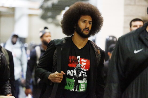 San Francisco 49ers quarterback Colin Kaepernick enters the Georgia Dome with team mates before the first half of an NFL football game between the Atlanta Falcons and the San Francisco 49ers, Sunday, Dec. 18, 2016, in Atlanta. (AP Photo/Butch Dill)
