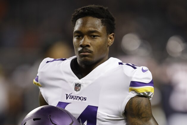Minnesota Vikings wide receiver Stefon Diggs (14) warms up before an NFL football game, Monday, Oct. 9, 2017, in Chicago. (AP Photo/Darron Cummings)