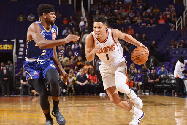 PHOENIX, AZ - OCTOBER 13:  Devin Booker #1 of the Phoenix Suns handles the ball during the preseason game against the Brisbane Bullets on October 13, 2017 at Talking Stick Resort Arena in Phoenix, Arizona. NOTE TO USER: User expressly acknowledges and agrees that, by downloading and or using this photograph, user is consenting to the terms and conditions of the Getty Images License Agreement. Mandatory Copyright Notice: Copyright 2017 NBAE (Photo by Barry Gossage/NBAE via Getty Images)