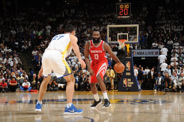 OAKLAND, CA - OCTOBER 17: James Harden #13 of the Houston Rockets handles the ball against the Golden State Warriors on October 17, 2017 at ORACLE Arena in Oakland, California. NOTE TO USER: User expressly acknowledges and agrees that, by downloading and or using this photograph, user is consenting to the terms and conditions of Getty Images License Agreement. Mandatory Copyright Notice: Copyright 2017 NBAE (Photo by Noah Graham/NBAE via Getty Images)