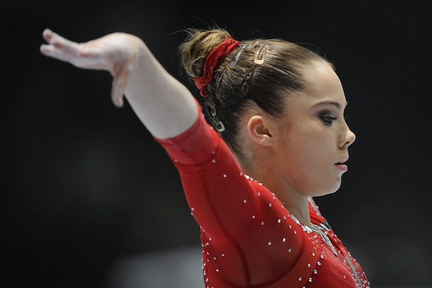 US gymnast McKayla Maroney competes on uneven bars during the 44th Artistic Gymnastics World Championships in Antwerp on October 2, 2013.  AFP PHOTO / JOHN THYS        (Photo credit should read JOHN THYS/AFP/Getty Images)
