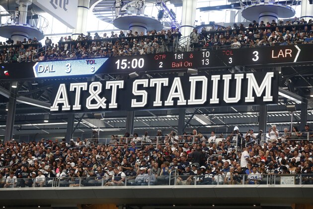 A AT&T Stadium sign is seen over fans sitting in an end zone watching the Los Angeles Rams play the Dallas Cowboys in an NFL football game, Sunday, Oct. 1, 2017, in Arlington, Texas. (AP Photo/Michael Ainsworth)