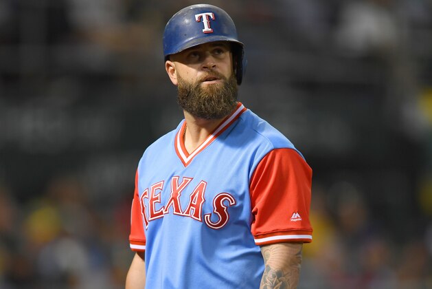 OAKLAND, CA - AUGUST 25:  Mike Napoli #5 of the Texas Rangers looks on as he walks back to the dugout after striking out against the Oakland Athletics in the top of the fourth inning at Oakland Alameda Coliseum on August 25, 2017 in Oakland, California.  (Photo by Thearon W. Henderson/Getty Images)