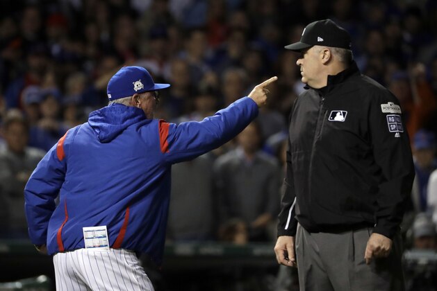 Chicago Cubs manager Joe Maddon argues with referees during the eighth inning of Game 4 of baseball's National League Championship Series against the Los Angeles Dodgers, Wednesday, Oct. 18, 2017, in Chicago. Maddon was ejected from the game. (AP Photo/Matt Slocum)
