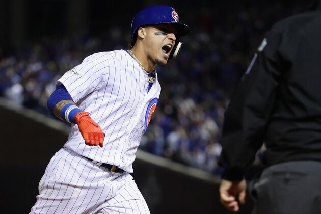 CHICAGO, IL - OCTOBER 18:  Javier Baez #9 of the Chicago Cubs celebrates while rounding the bases after hitting a home run in the fifth inning against the Los Angeles Dodgers during game four of the National League Championship Series at Wrigley Field on October 18, 2017 in Chicago, Illinois.  (Photo by Jonathan Daniel/Getty Images)