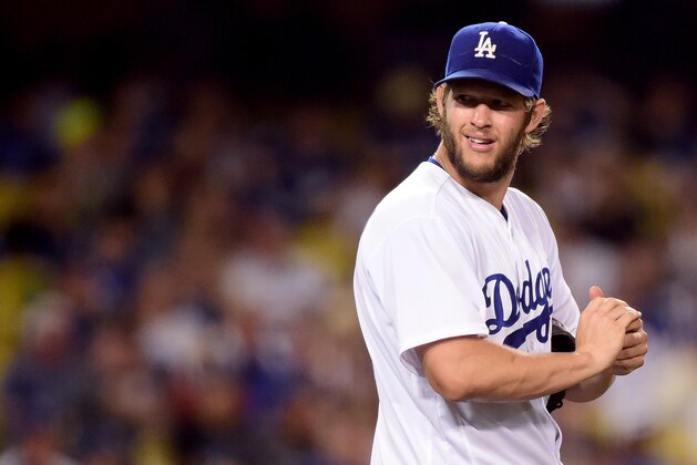 LOS ANGELES, CA - JUNE 20:  Clayton Kershaw #22 of the Los Angeles Dodgers reacts to his wild pitch during the seventh inning against the Washington Nationals at Dodger Stadium on June 20, 2016 in Los Angeles, California.  (Photo by Harry How/Getty Images)