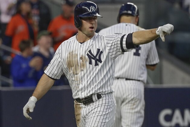 New York Yankees' Brett Gardner reacts after scoring during the third inning of Game 5 of baseball's American League Championship Series against the Houston Astros Wednesday, Oct. 18, 2017, in New York. (AP Photo/David J. Phillip)