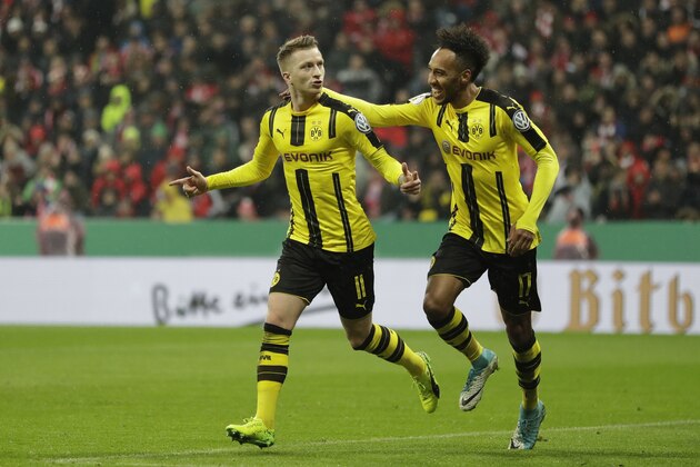 Dortmund's Marco Reus, left, celebrates after scoring his side's opening goal besides team mate Dortmund's Pierre-Emerick Aubameyang during the German Soccer Cup semifinal match between FC Bayern Munich and Borussia Dortmund at the Allianz Arena stadium in Munich, Germany, Wednesday, April 26, 2017. (AP Photo/Matthias Schrader)