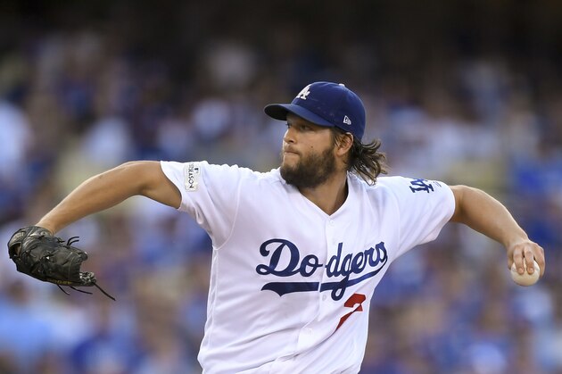 Los Angeles Dodgers starting pitcher Clayton Kershaw throws against the Chicago Cubs during the first inning of Game 1 of baseball's National League Championship Series in Los Angeles, Saturday, Oct. 14, 2017. (AP Photo/Mark J. Terrill)