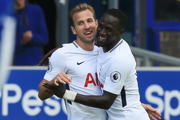 Tottenham Hotspur's English striker Harry Kane (L) celebrates scoring the opening goal with teammate Tottenham Hotspur's French midfielder Moussa Sissoko (R) during the English Premier League football match between Everton and Tottenham Hotspur at Goodison Park in Liverpool, north west England on September 9, 2017. / AFP PHOTO / Lindsey PARNABY / RESTRICTED TO EDITORIAL USE. No use with unauthorized audio, video, data, fixture lists, club/league logos or 'live' services. Online in-match use limited to 75 images, no video emulation. No use in betting, games or single club/league/player publications.  /         (Photo credit should read LINDSEY PARNABY/AFP/Getty Images)