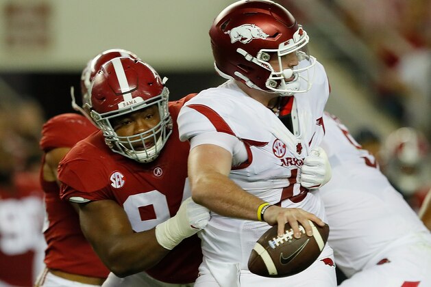 TUSCALOOSA, AL - OCTOBER 14:  Cole Kelley #15 of the Arkansas Razorbacks is pressured by Da'Ron Payne #94 of the Alabama Crimson Tide at Bryant-Denny Stadium on October 14, 2017 in Tuscaloosa, Alabama.  (Photo by Kevin C. Cox/Getty Images)