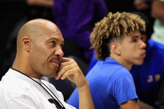 LOS ANGELES, CA - AUGUST 13:  (L-R) Lavar Ball and LaMelo Ball look on from the audience during week eight of the BIG3 three on three basketball league at Staples Center on August 13, 2017 in Los Angeles, California.  (Photo by Sean M. Haffey/Getty Images)