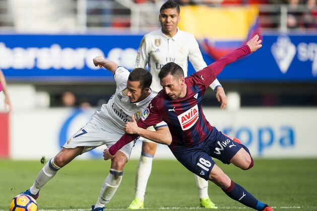 EIBAR, SPAIN - MARCH 04: Lucas Vazquez of Real Madrid duels for the ball with Anaitz Arbilla of SD Eibar during the La Liga match between SD Eibar and Real Madrid at Ipurua Municipal Stadium on March 4, 2017 in Eibar, Spain.  (Photo by Juan Manuel Serrano Arce/Getty Images)
