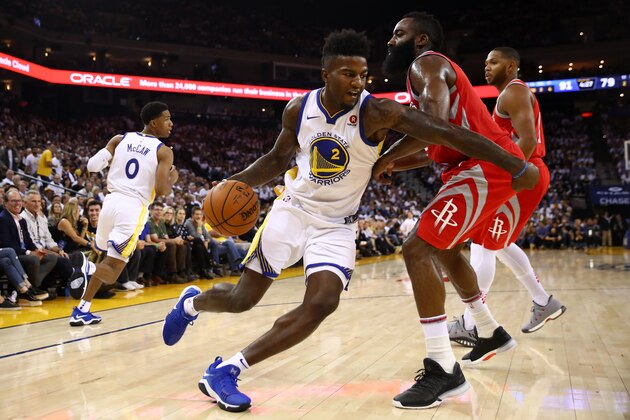 OAKLAND, CA - OCTOBER 17:  Jordan Bell #2 of the Golden State Warriors drives to the hoop against James Harden #13 of the Houston Rockets during their NBA game at ORACLE Arena on October 17, 2017 in Oakland, California. NOTE TO USER: User expressly acknowledges and agrees that, by downloading and or using this photograph, User is consenting to the terms and conditions of the Getty Images License Agreement.  (Photo by Ezra Shaw/Getty Images)