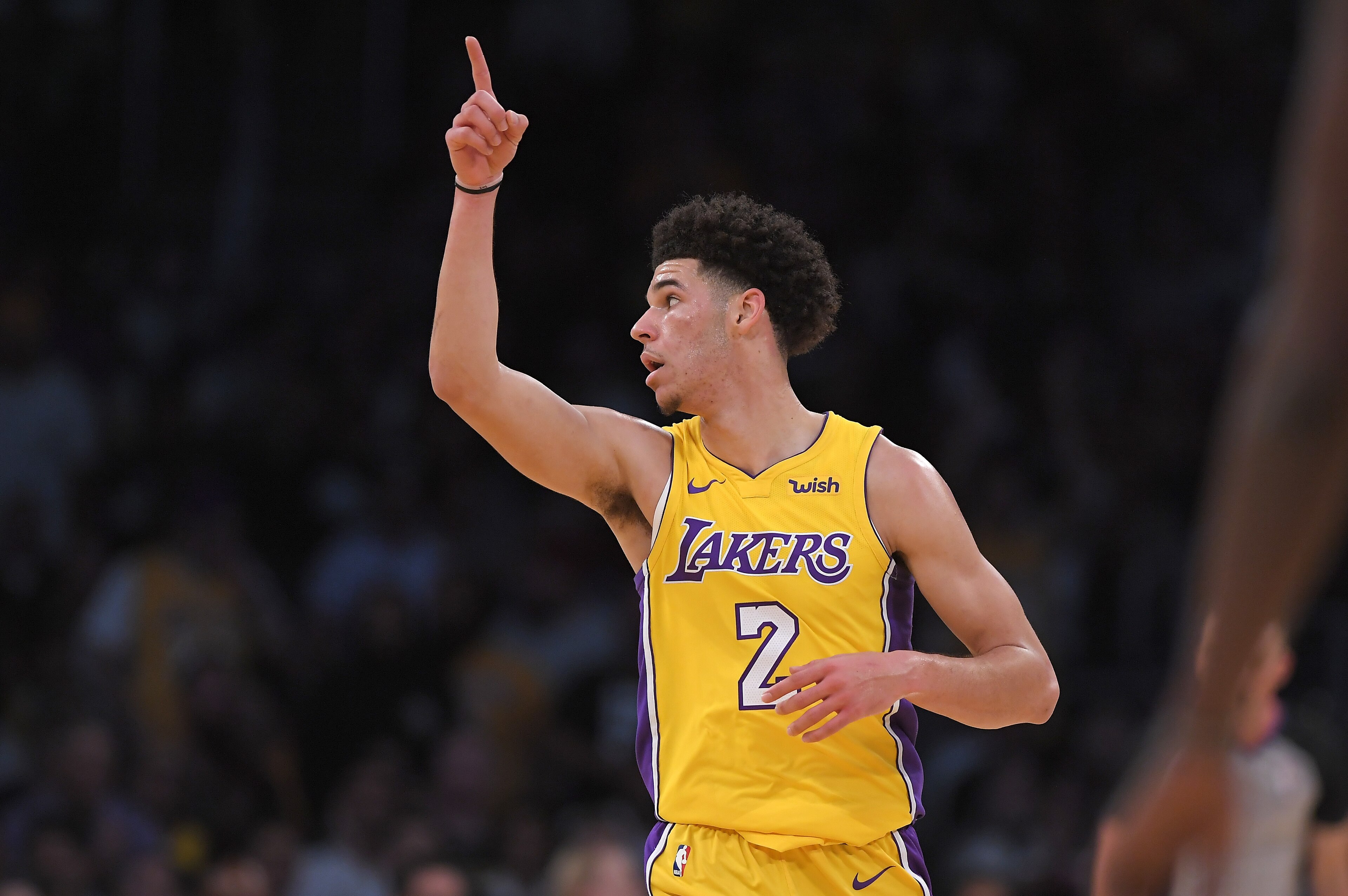 Los Angeles Lakers guard Lonzo Ball gestures after dunking during the first half of a preseason NBA basketball game against the Denver Nuggets, Monday, Oct. 2, 2017, in Los Angeles. (AP Photo/Mark J. Terrill)