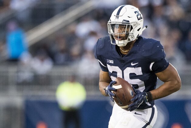 UNIVERSITY PARK, PA - SEPTEMBER 30:  Saquon Barkley #26 of the Penn State Nittany Lions runs with the ball prior to throwing a touchdown pass during the second half against the Indiana Hoosiers on September 30, 2017 at Beaver Stadium in University Park, Pennsylvania. Penn State defeats Indiana 45-14.  (Photo by Brett Carlsen/Getty Images)
