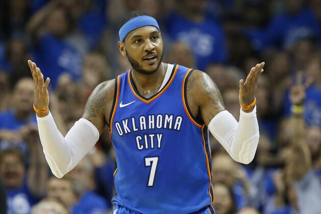 Oklahoma City Thunder forward Carmelo Anthony (7) gestures after hitting a three-point basket in the second quarter of an NBA basketball game against the New York Knicks in Oklahoma City, Thursday, Oct. 19, 2017. (AP Photo/Sue Ogrocki)