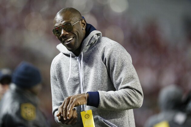 Former NFL wide receiver and Chattanooga alum Terrell Owens walks the sidelines during the second half of an NCAA college football game with Alabama and Chattanooga, Saturday, Nov. 19, 2016, in Tuscaloosa, Ala. (AP Photo/Brynn Anderson)
