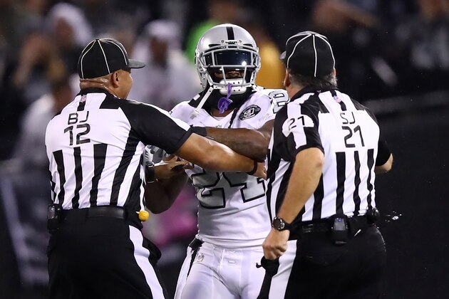 OAKLAND, CA - OCTOBER 19:  Marshawn Lynch #24 of the Oakland Raiders is restrained after coming off the bench and shoving a referee during a scrum with the Kansas City Chiefs in their NFL game at Oakland-Alameda County Coliseum on October 19, 2017 in Oakland, California. Lynch was ejected for unsportsmanlike conduct.  (Photo by Ezra Shaw/Getty Images)