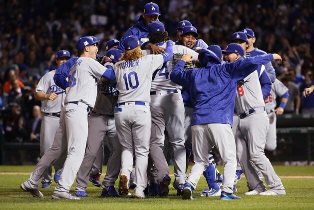 CHICAGO, IL - OCTOBER 19:  The Los Angeles Dodgers celebrate defeating the Chicago Cubs 11-1 in game five of the National League Championship Series at Wrigley Field on October 19, 2017 in Chicago, Illinois. The Dodgers advance to the 2017 World Series.  (Photo by Jonathan Daniel/Getty Images)