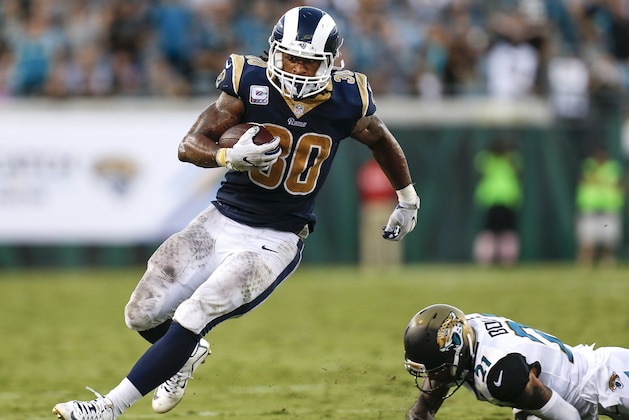 JACKSONVILLE, FL - OCTOBER 15: Runningback Todd Gurley II #30 of the Los Angeles Rams avoids a tackle by Cornerback A.J. Bouye #21 of the Jacksonville Jaguars on a running play during the game at EverBank Field on October 15, 2017 in Jacksonville, Florida. The Rams defeated the Jaguars 24 to 17. (Photo by Don Juan Moore/Getty Images)