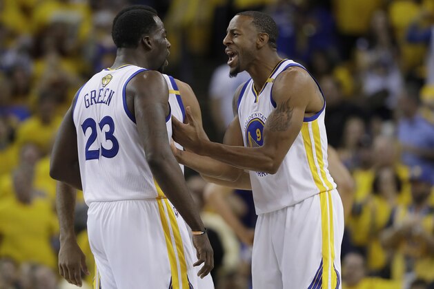 Golden State Warriors forward Draymond Green (23) and forward Andre Iguodala (9) celebrate during the second half of Game 1 of basketball's NBA Finals against the Cleveland Cavaliers in Oakland, Calif., Thursday, June 1, 2017. (AP Photo/Marcio Jose Sanchez)