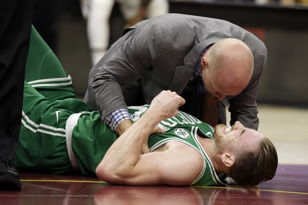 Boston Celtics' Gordon Hayward grimaces in pain in the first half of an NBA basketball game against the Cleveland Cavaliers, Tuesday, Oct. 17, 2017, in Cleveland. Just five minutes into his Boston career, new Celtics star forward Gordon Hayward gruesomely broke his left ankle, an injury that may end his season. (AP Photo/Tony Dejak)
