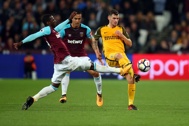 LONDON, ENGLAND - OCTOBER 20: Pedro Obiang of West Ham United and Winston Reid of West Ham United tackle Pascal Gross of Brighton and Hove Albion during the Premier League match between West Ham United and Brighton and Hove Albion at London Stadium on October 20, 2017 in London, England. (Photo by Catherine Ivill - AMA/Getty Images)