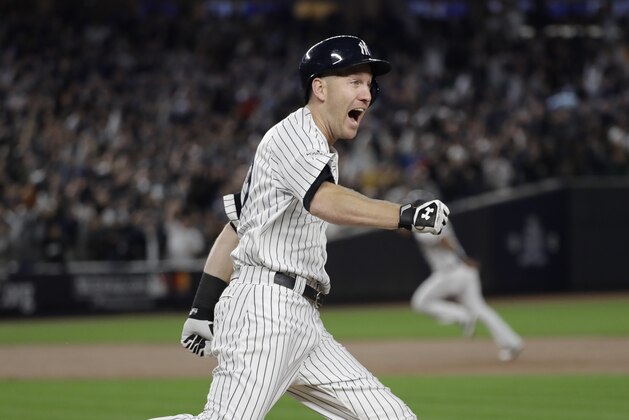 New York Yankees' Todd Frazier reacts after hitting a home run during the third inning of Game 3 of baseball's American League Championship Series against the Houston Astros Monday, Oct. 16, 2017, in New York. (AP Photo/David J. Phillip)