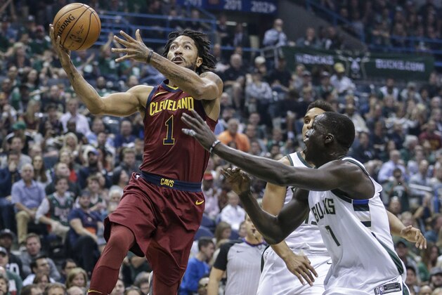 Milwaukee Bucks' Thon Maker, right, defends against a driving Cleveland Cavaliers' Derrick Rose during the first half of an NBA basketball game Friday, Oct. 20, 2017, in Milwaukee. (AP Photo/Tom Lynn)