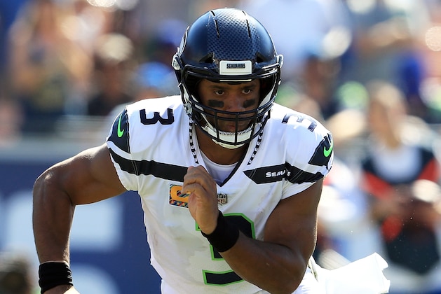 LOS ANGELES, CA - OCTOBER 08:  Russell Wilson #3 of the Seattle Seahawks runs with the ball during the game against the Los Angeles Rams at the Los Angeles Memorial Coliseum on October 8, 2017 in Los Angeles, California.  (Photo by Sean M. Haffey/Getty Images)