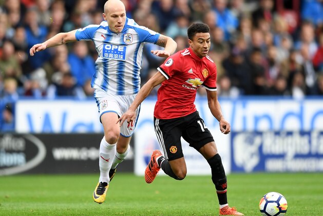 HUDDERSFIELD, ENGLAND - OCTOBER 21:  Jesse Lingard of Manchester United evades Aaron Mooy of Huddersfield Town during the Premier League match between Huddersfield Town and Manchester United at John Smith's Stadium on October 21, 2017 in Huddersfield, England.  (Photo by Gareth Copley/Getty Images)