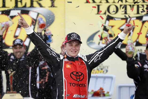 Christopher Bell celebrates after winning the NASCAR Xfinity Series auto race at Kansas Speedway in Kansas City, Kan., Saturday, Oct. 21, 2017. (AP Photo/Colin E. Braley)