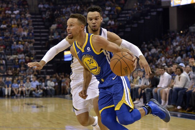Golden State Warriors guard Stephen Curry (30) drives against Memphis Grizzlies forward Dillon Brooks during the first half of an NBA basketball game Saturday, Oct. 21, 2017, in Memphis, Tenn. (AP Photo/Brandon Dill)