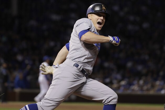 Los Angeles Dodgers' Enrique Hernandez reacts after hitting a hoe run off Chicago Cubs relief pitcher Mike Montgomery during the ninth inning of Game 5 of baseball's National League Championship Series, Thursday, Oct. 19, 2017, in Chicago. (AP Photo/Matt Slocum) Los Angeles Dodgers' Enrique Hernandez reacts after hitting a hoe run off Chicago Cubs relief pitcher Mike Montgomery during the ninth inning of Game 5 of baseball's National League Championship Series, Thursday, Oct. 19, 2017, in Chicago. (AP Photo/Matt Slocum)