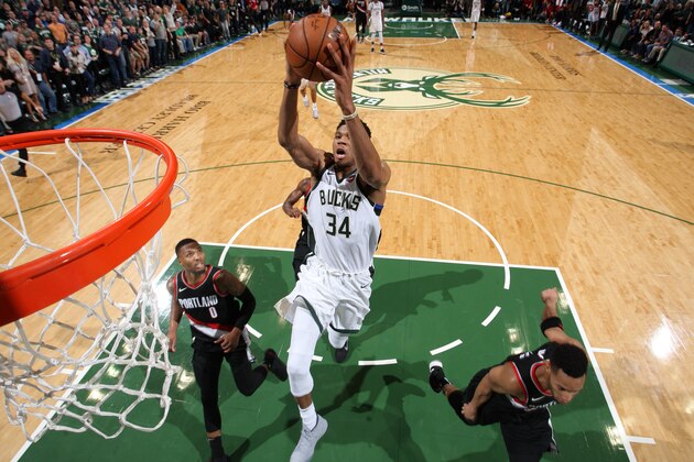 Milwaukee, WI - OCTOBER 21: Giannis Antetokounmpo #34 of the Milwaukee Bucks dunks and put his team in the lead against the Portland Trail Blazers on October 21, 2017 at the BMO Harris Bradley Center in Milwaukee, Wisconsin. NOTE TO USER: User expressly acknowledges and agrees that, by downloading and or using this Photograph, user is consenting to the terms and conditions of the Getty Images License Agreement. Mandatory Copyright Notice: Copyright 2017 NBAE (Photo by Gary Dineen/NBAE via Getty Images)