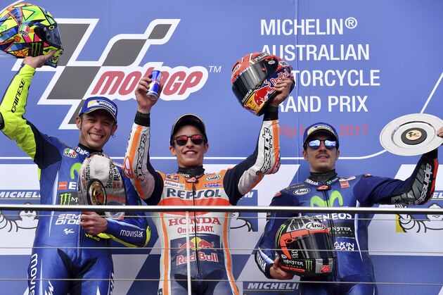 Race winner Spain's Marc Marquez, centre, stands on the podium with second placed Italy's Valentino Rossi, left, and third placed Spain's Maverick Vinales, right, after winning the Australian Motorcycle Grand Prix at Phillip Island near Melbourne, Australia, Sunday, Oct. 22, 2017. (AP Photo/Andy Brownbill) Race winner Spain's Marc Marquez, centre, stands on the podium with second placed Italy's Valentino Rossi, left, and third placed Spain's Maverick Vinales, right, after winning the Australian Motorcycle Grand Prix at Phillip Island near Melbourne, Australia, Sunday, Oct. 22, 2017. (AP Photo/Andy Brownbill)