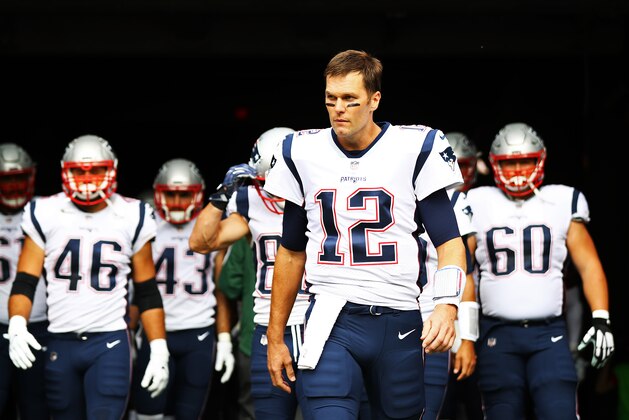 EAST RUTHERFORD, NJ - OCTOBER 15: Tom Brady #12 of the New England Patriots leads his team onto the field against the New York Jets before their game at MetLife Stadium on October 15, 2017 in East Rutherford, New Jersey.  (Photo by Al Bello/Getty Images)