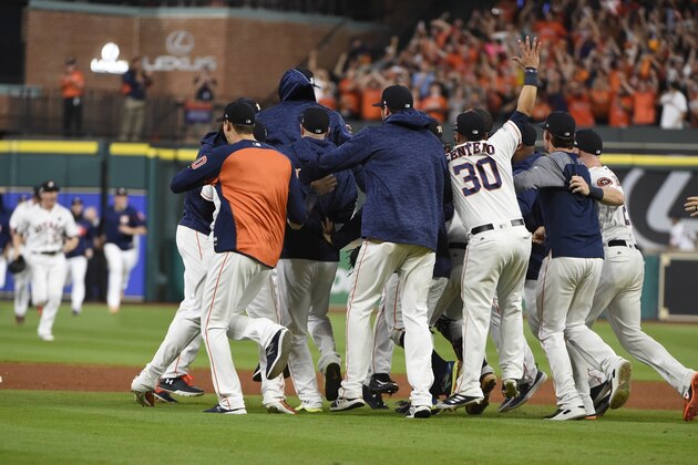 Houston Astros players celebrate after Game 7 of baseball's American League Championship Series against the New York Yankees Saturday, Oct. 21, 2017, in Houston. The Astros won 4-0 to win the series. (AP Photo/Eric Christian Smith)