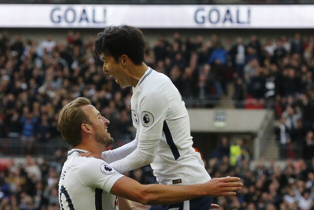Tottenham's Son Heung-min, top, and Tottenham's Harry Kane celebrate after scoring their side's second goal during the English Premier League soccer match between Tottenham Hotspur and Liverpool at Wembley Stadium in London, Sunday, Oct. 22, 2017. (AP Photo/Frank Augstein)