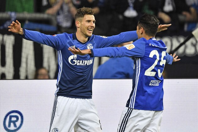 Schalke's Leon Goretzka celebrates with teammate Amine Harit, right, after he scored the opening goal during the German Bundesliga soccer match between FC Schalke 04 and FSV Mainz 05 at the Arena in Gelsenkirchen, Germany, Friday, Oct. 20, 2017. (AP Photo/Martin Meissner)