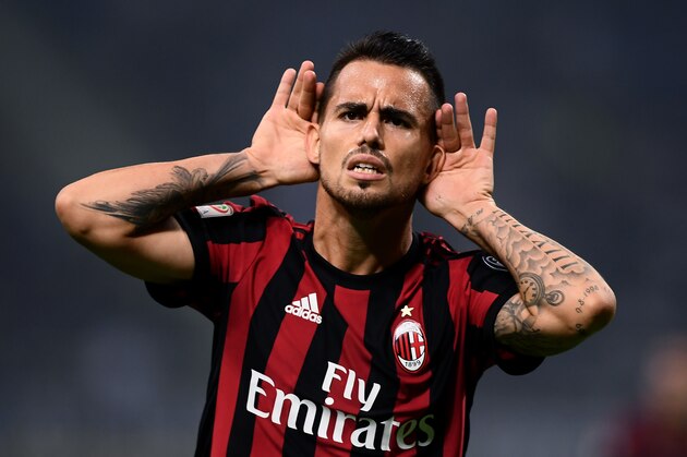 AC Milan's midfielder Suso from Spain celebrates after scoring during the Italian Serie A football match Inter Milan Vs AC Milan on October 15, 2017 at the 'San Siro Stadium' in Milan.  / AFP PHOTO / MARCO BERTORELLO        (Photo credit should read MARCO BERTORELLO/AFP/Getty Images)