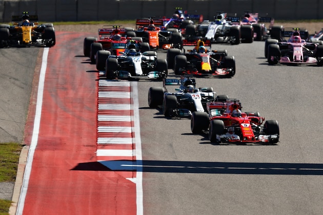 AUSTIN, TX - OCTOBER 22:  Sebastian Vettel of Germany driving the (5) Scuderia Ferrari SF70H leads Lewis Hamilton of Great Britain driving the (44) Mercedes AMG Petronas F1 Team Mercedes F1 WO8 on track during the United States Formula One Grand Prix at Circuit of The Americas on October 22, 2017 in Austin, Texas.  (Photo by Clive Rose/Getty Images)
