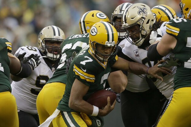 Green Bay Packers quarterback Brett Hundley (7) tries to run from New Orleans Saints defense during the second half of an NFL football game, Sunday, Oct. 22, 2017, in Green Bay, Wis. (AP Photo/Jeffrey Phelps)