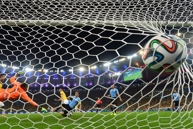Uruguay's goalkeeper Fernando Muslera fails to save Colombia's midfielder James Rodriguez' second goal during the Round of 16 football match between Colombia and Uruguay at the Maracana Stadium in Rio de Janeiro during the 2014 FIFA World Cup in Brazil on June 28, 2014.  AFP PHOTO / LUIS ACOSTA        (Photo credit should read LUIS ACOSTA/AFP/Getty Images)