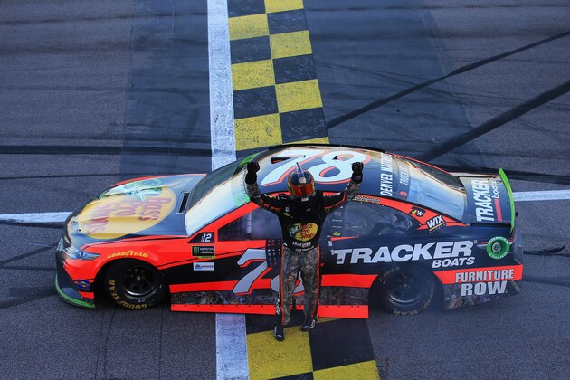 KANSAS CITY, KS - OCTOBER 22:  Martin Truex Jr., driver of the #78 Bass Pro Shops/Tracker Boats Toyota, celebrates winning the Monster Energy NASCAR Cup Series Hollywood Casino 400 at Kansas Speedway on October 22, 2017 in Kansas City, Kansas.  (Photo by Chris Trotman/Getty Images)