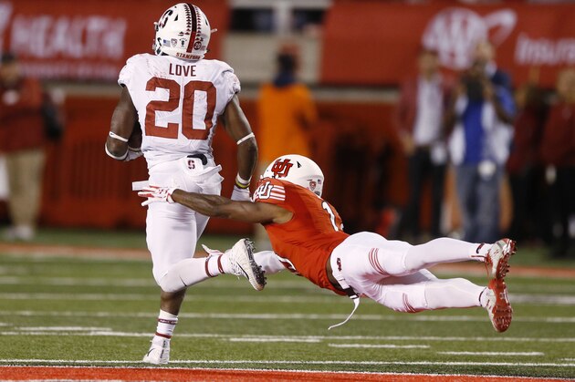 Stanford running back Bryce Love (20) runs for a touchdown as Utah defensive back Marquise Blair, right, misses a tackle in the second half during an NCAA college football game Saturday, Oct. 7, 2017, in Salt Lake City. (AP Photo/Rick Bowmer)