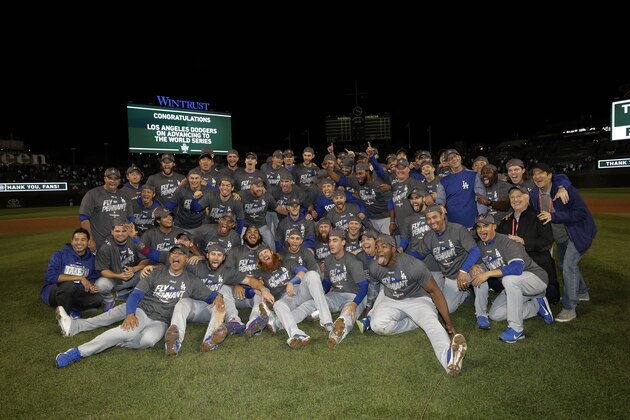 The Los Angeles Dodgers players celebrate after Game 5 of baseball's National League Championship Series against the Chicago Cubs, Thursday, Oct. 19, 2017, in Chicago. The Dodgers won 11-1 to win the series and advance to the World Series. (AP Photo/Matt Slocum)